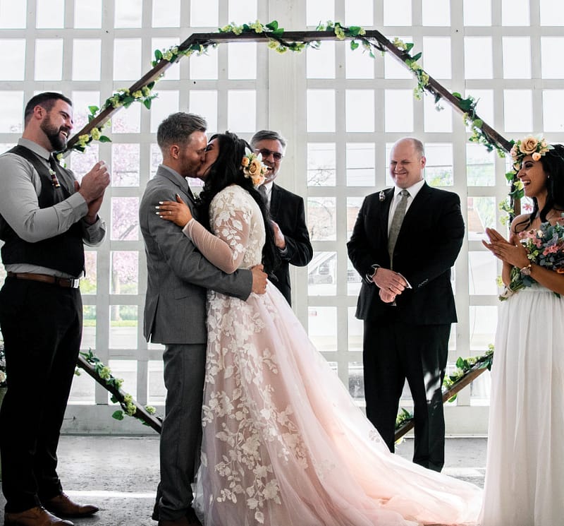 couple getting married in tuxedo, wedding dress